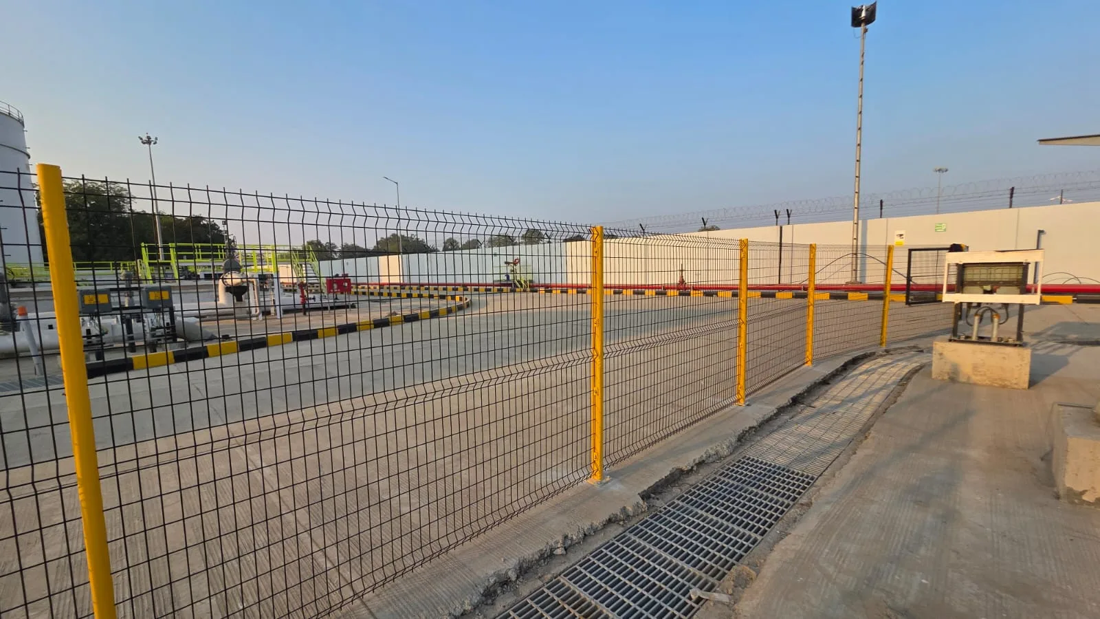 Long run of Nexus Indus-Shield yellow-post welded mesh fence at SVPIA Ahmedabad