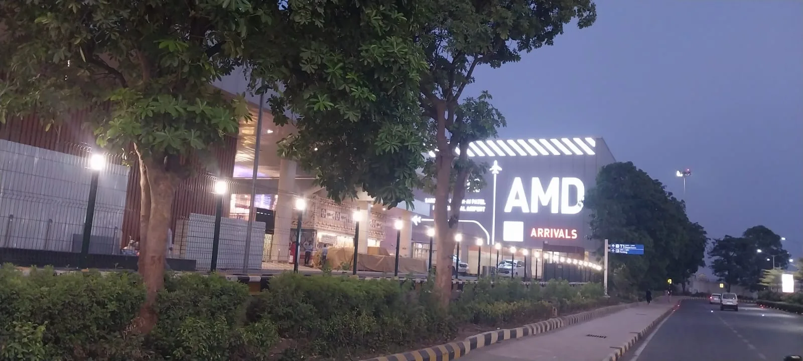 Nexus Lumos illuminated fence posts lighting the arrivals approach road at SVPIA Ahmedabad at night